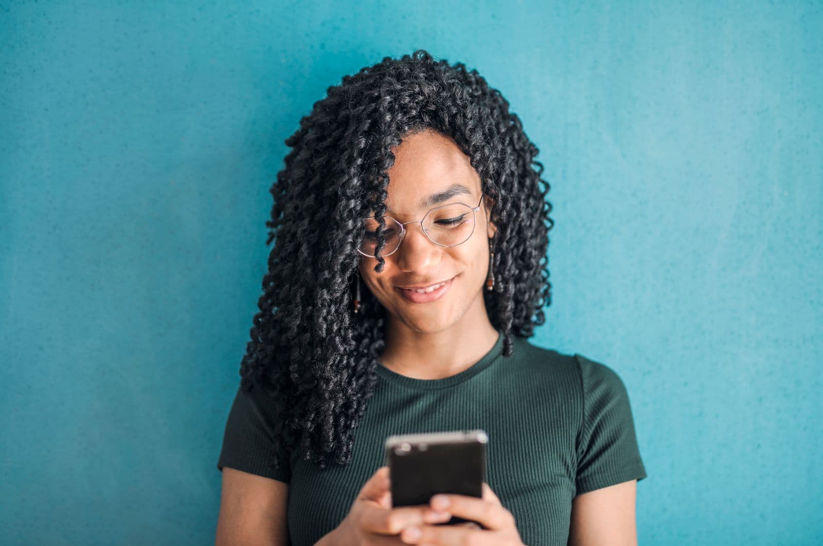 A learner paying on her phone
